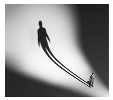 Person casting a proportionally large shadow